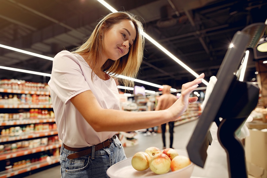 Core De Force Meal Plan Tips Woman Buying Fruit at a Grocery Store Self Checkout Machine