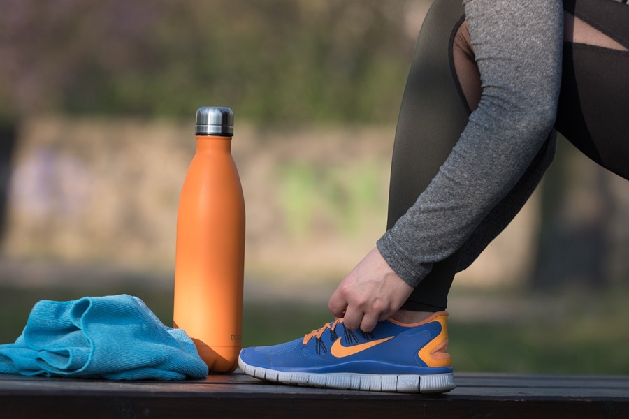 Transform 20 Week 4 Workouts and Tips Close Up of a Person Tying Running Shoes Outdoors