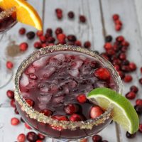 Cranberries lend themselves perfectly to the holidays and this cranberry margarita recipe balances tequila with seasonal cranberries perfectly! Cranberry Margarita by the Glass | Spiced Cranberry Margarita | Holiday Margarita Recipe | Holiday Party Recipe | Christmas Party Recipe | Christmas Cocktail Recipe