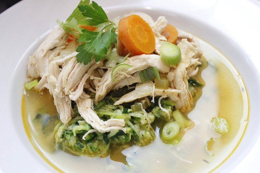 Low Carb Crockpot Chicken and Veggies Soup in a White Bowl