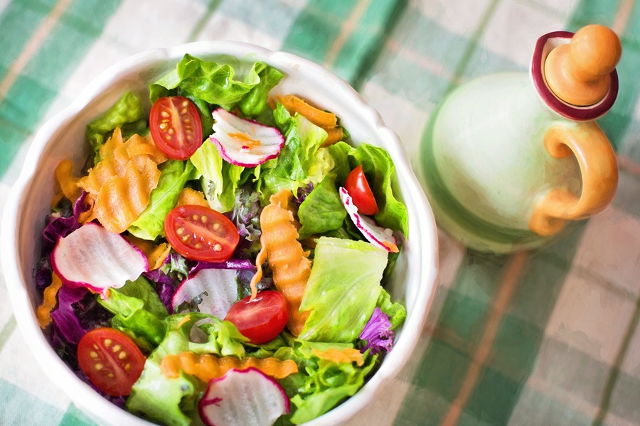 Intermittent Fasting 168 Foods to Eat a Bowl Filled with Salad on a Table