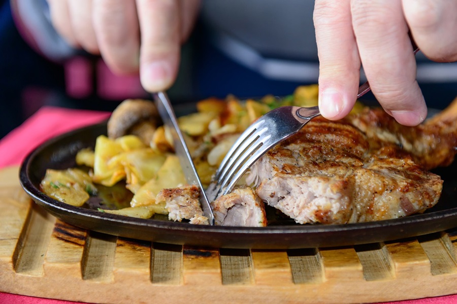 Freezer Meals for DiabeticsClose Up of a Person Cutting a Piece of Meat on a Plate