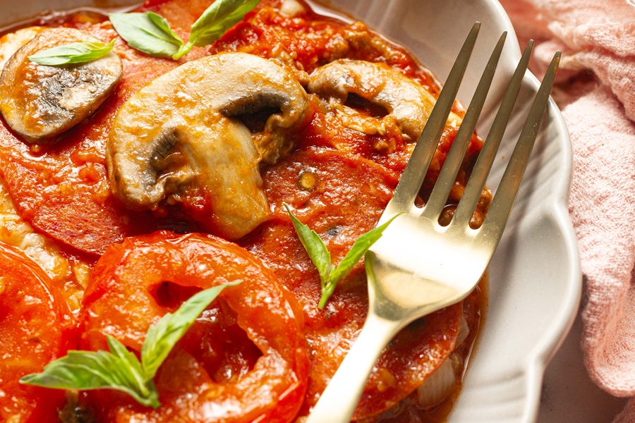 Keto Crockpot Casserole for Pizza Lovers Close Up of Pepperoni and Mushrooms in a Pizza Casserole with a Fork