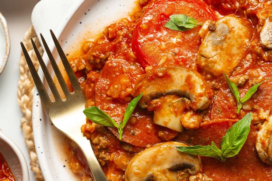 Keto Crockpot Casserole for Pizza Lovers Close Up of a Plate of Pizza Casserole with Fork