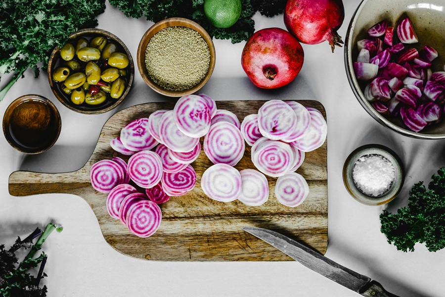 Fat Burning Juice Recipes Sliced beets on a Wooden Cutting Board